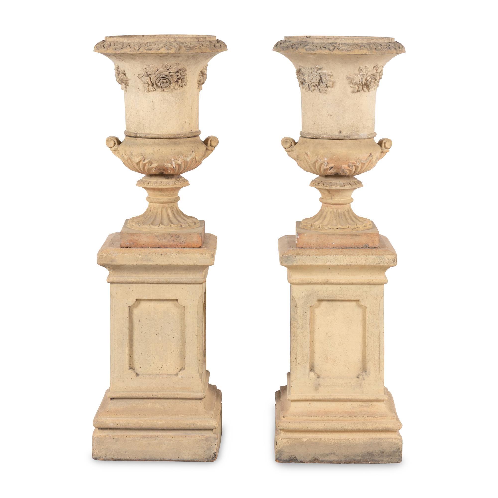 A Pair of Terra Cotta Garden Urns and Plinths