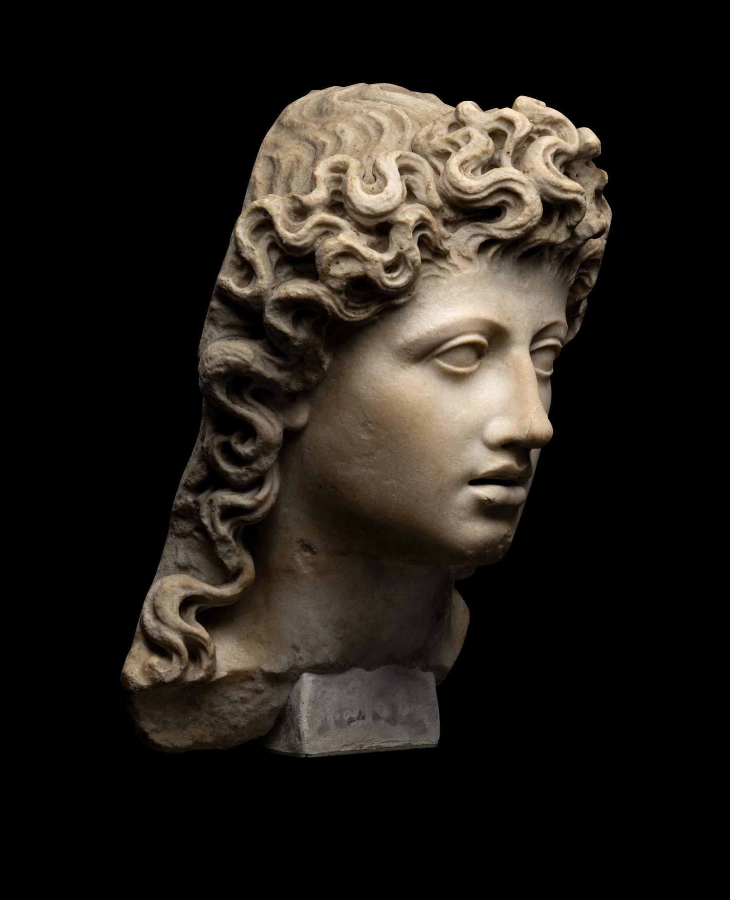A Roman Marble Head of a Triton