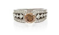 A 14 Karat White Gold, Colored Diamond and Diamond Ring, 7.40 dwts.