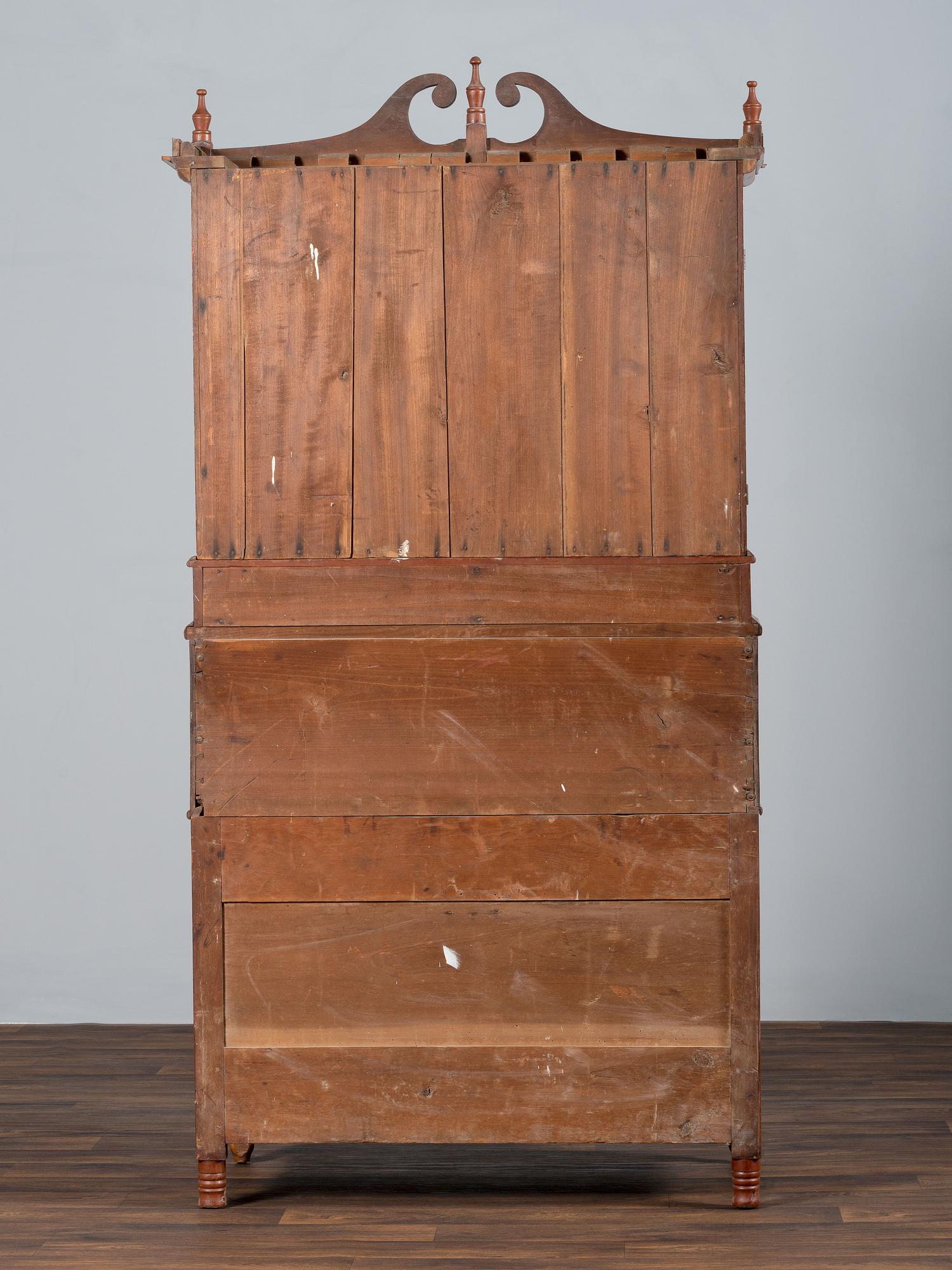 A Late Federal Cherry Wood and Tiger Maple Roll-Top Desk-and-Bookcase