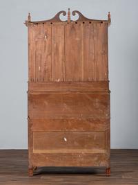 A Late Federal Cherry Wood and Tiger Maple Roll-Top Desk-and-Bookcase