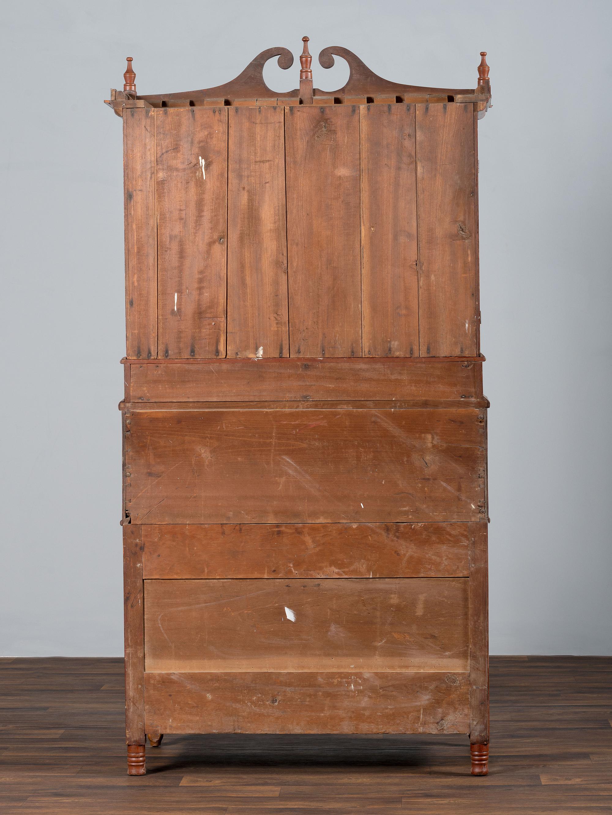 A Late Federal Cherry Wood and Tiger Maple Roll-Top Desk-and-Bookcase