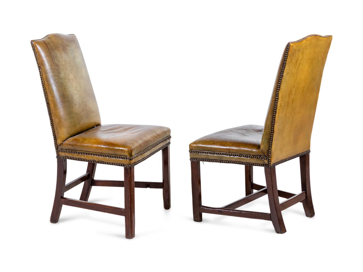 A Pair of George III Leather Upholstered Mahogany Side Chairs
