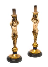 A Pair of Painted and Parcel Gilt Figural Candlesticks, Height overall 18 1/2 inches.