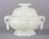A Near White Jade Lidded Koro, Height 3 1/2 x width (over handles) 4 3/4 x depth 3 7/8 inches.