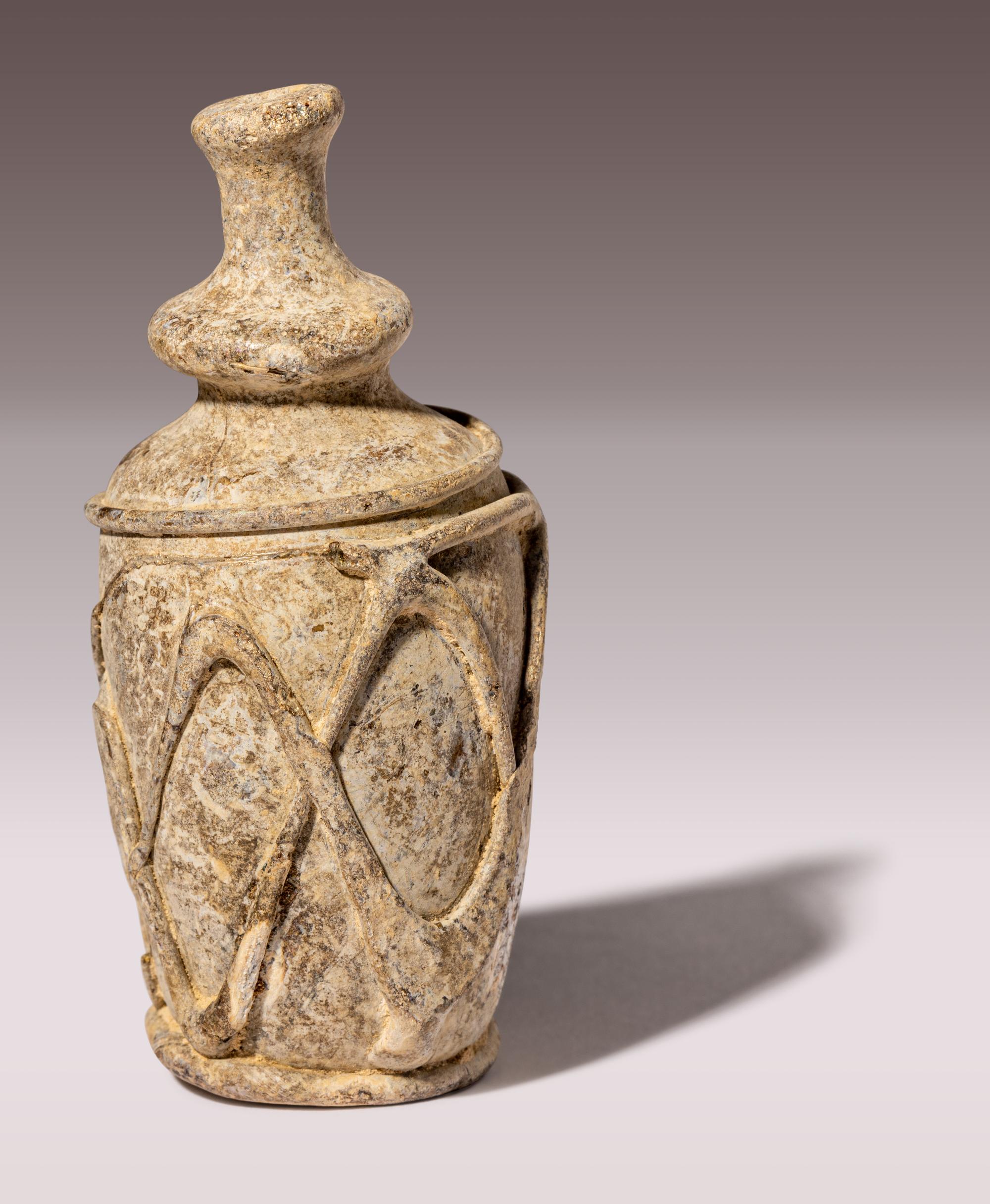 An Islamic Yellow-Green Glass Bottle