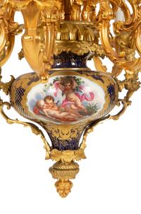 A Pair of Sèvres Style Porcelain and Gilt Bronze Nine-Light Chandeliers