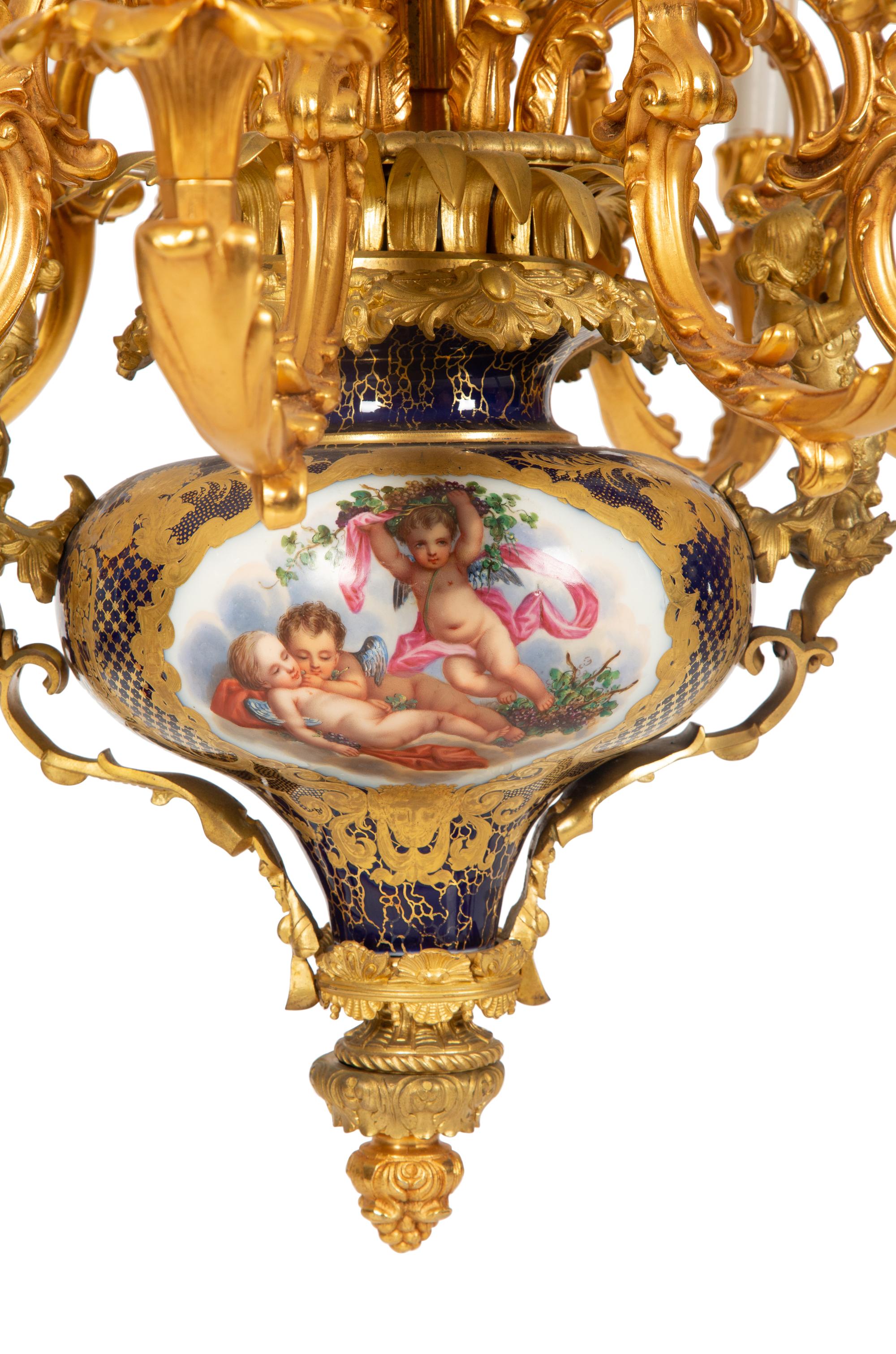 A Pair of Sèvres Style Porcelain and Gilt Bronze Nine-Light Chandeliers