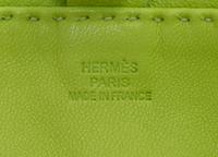An Hermes Kiwi Agneau Clou de Selle Pouch, 6" x 9" x 1".