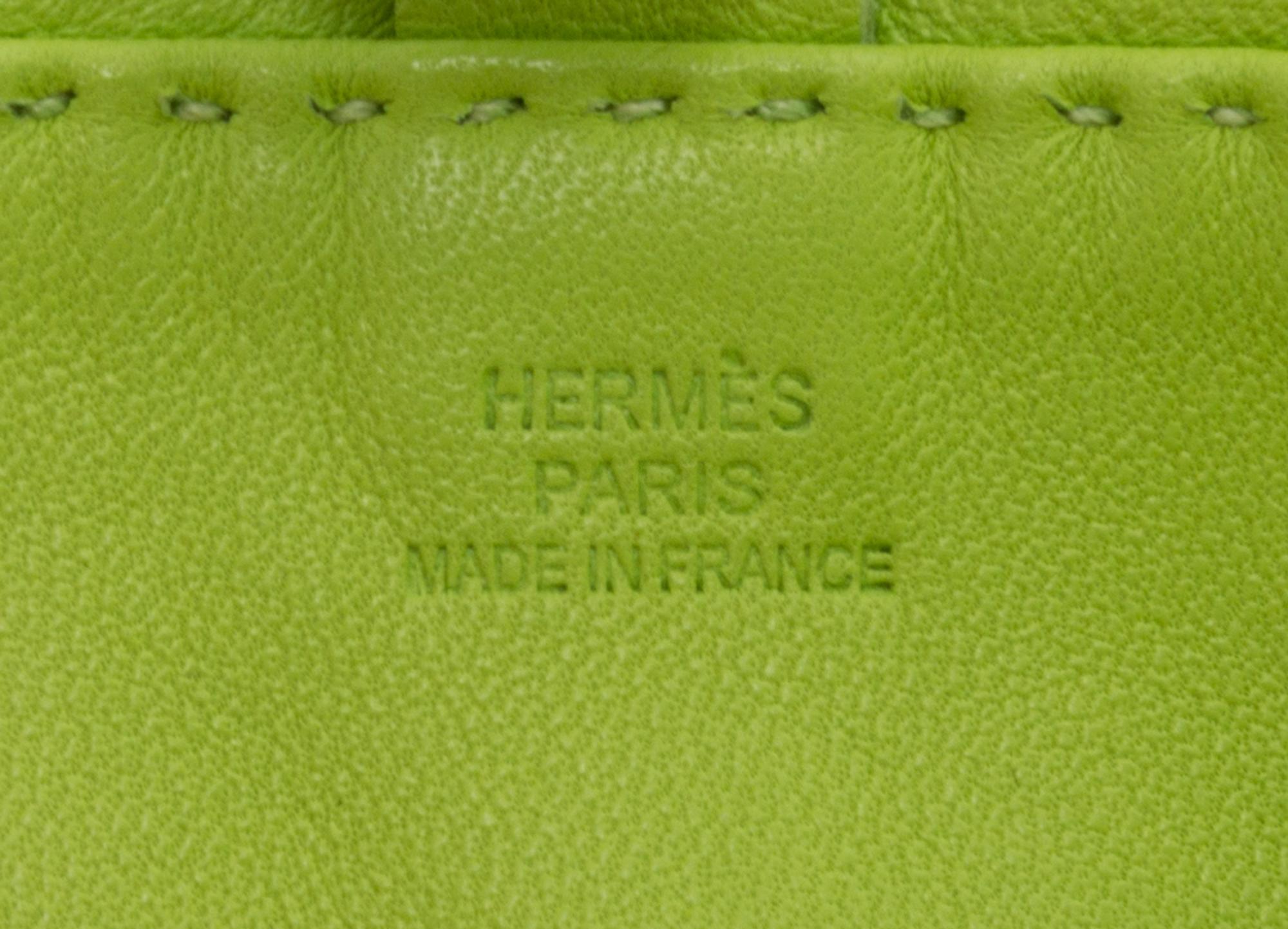 An Hermes Kiwi Agneau Clou de Selle Pouch, 6" x 9" x 1".