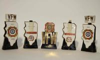 A Group of Eight Figural Pottery Bottles Height of tallest 12 1/4 inches.