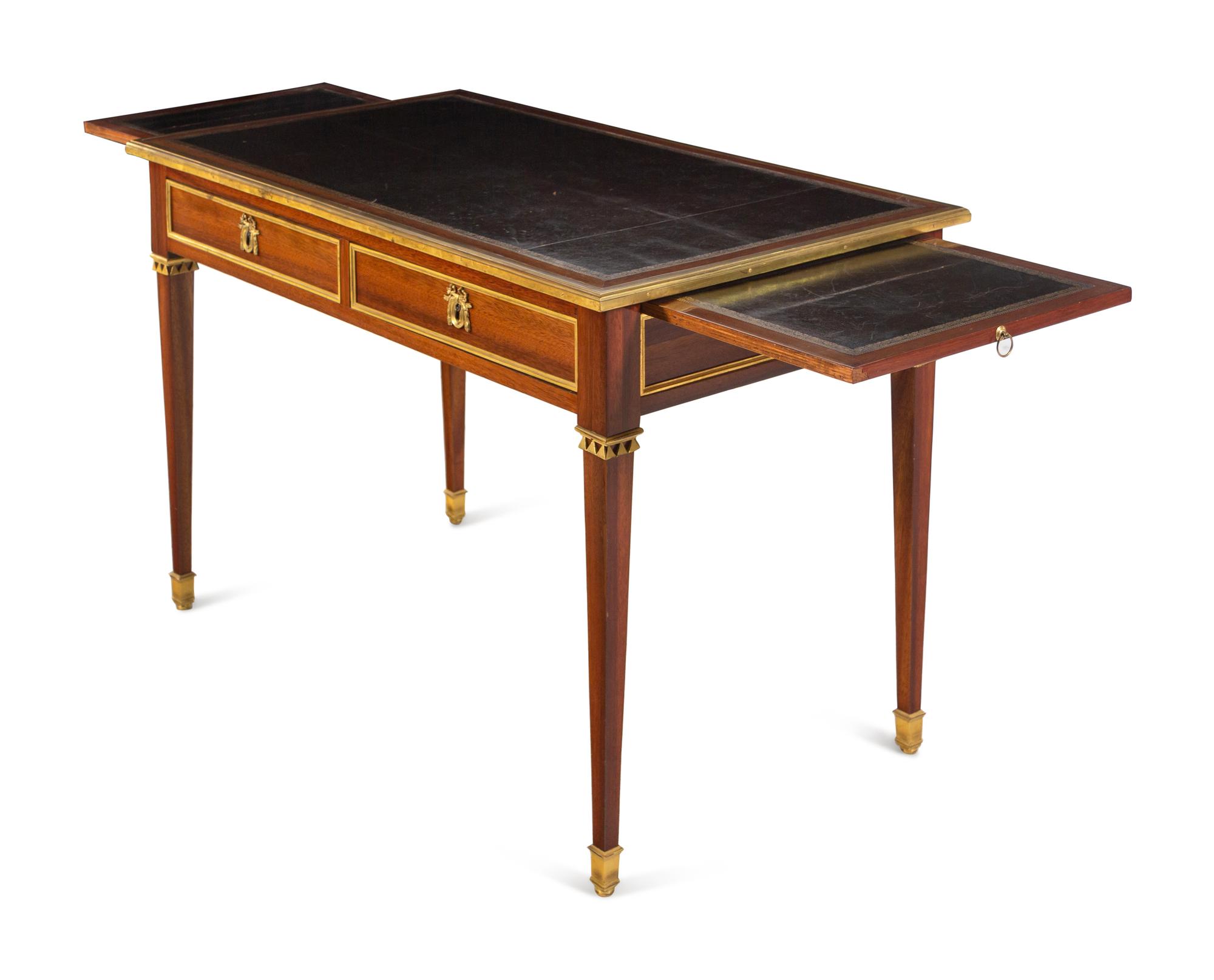 A Louis XVI Gilt Bronze Mounted Mahogany Bureau Plat by Claude-Charles Saunier (French, 1735-1807)