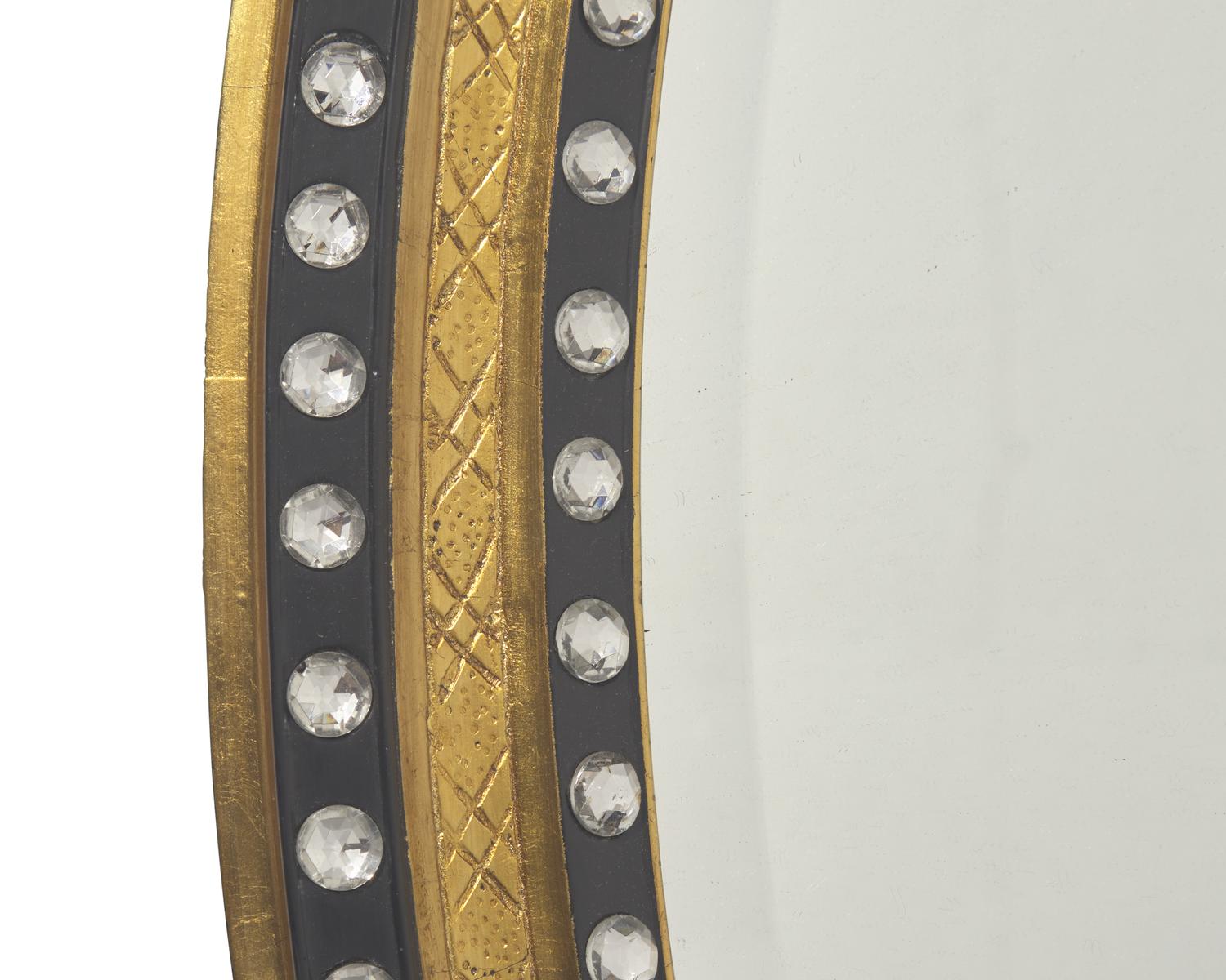 An Irish oval double-jeweled looking glass, 20th century