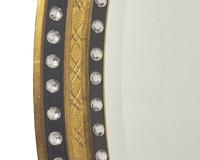 An Irish oval double-jeweled looking glass, 20th century