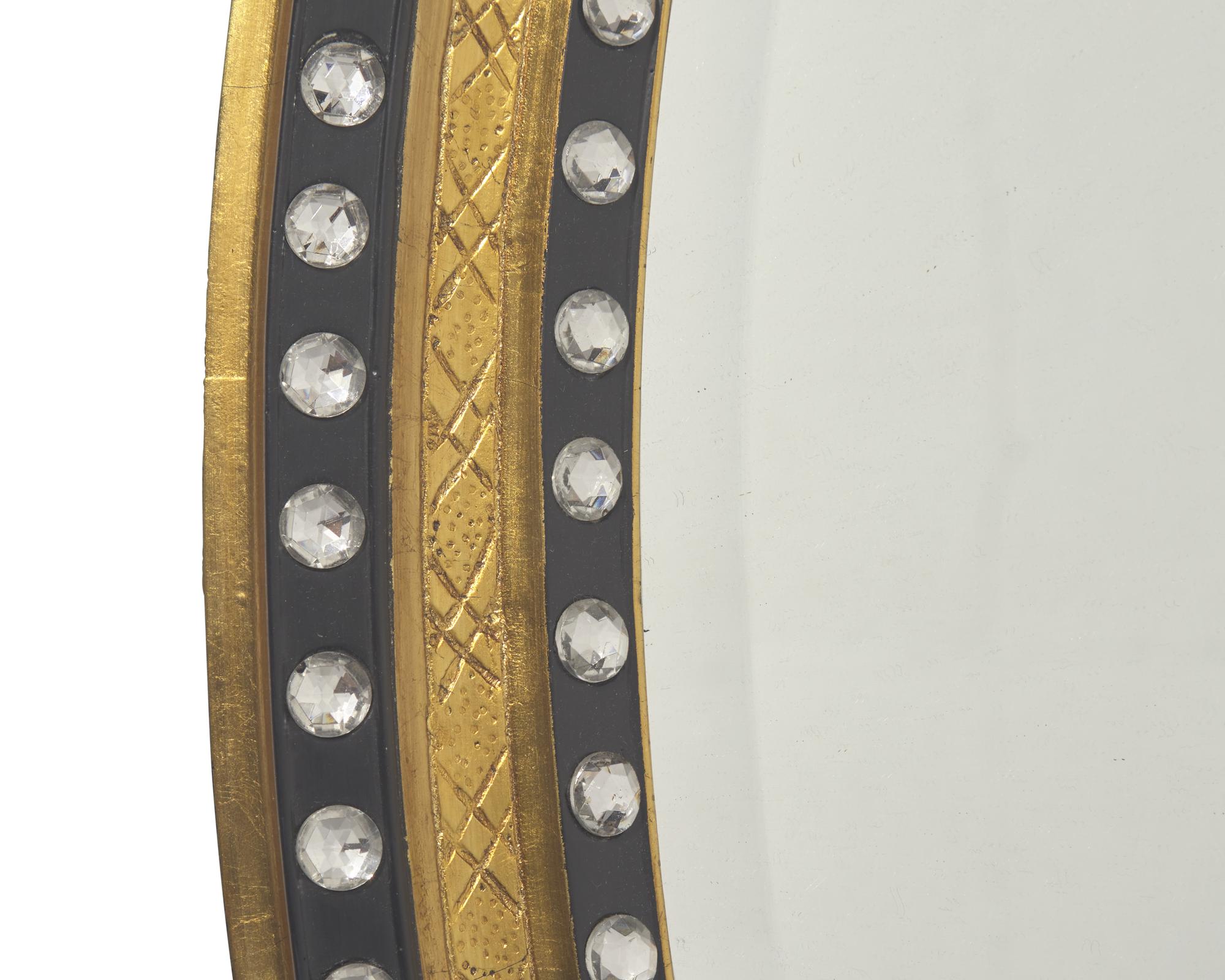 An Irish oval double-jeweled looking glass, 20th century
