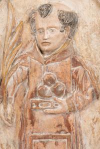 A Continental Carved Wood Plaque Depicting Saint Anthony of Padua