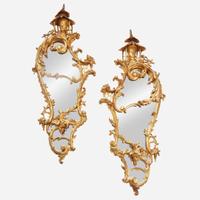 A pair of George III style giltwood mirrors in the Chinese taste early 20th century