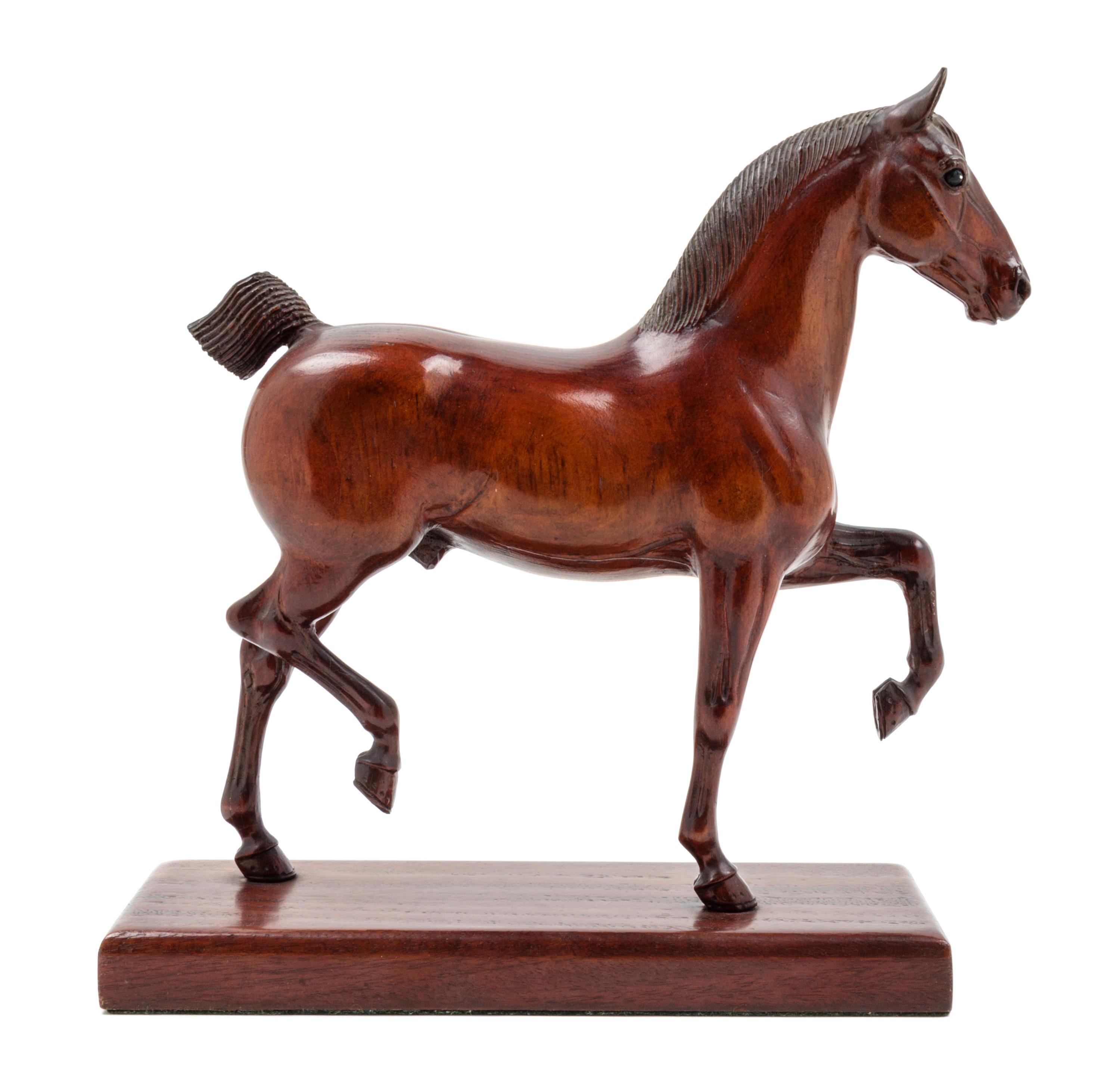 A Carved Wood Figure of a Horse Height 12 inches. — PETER GIBA, 20TH CENTURY