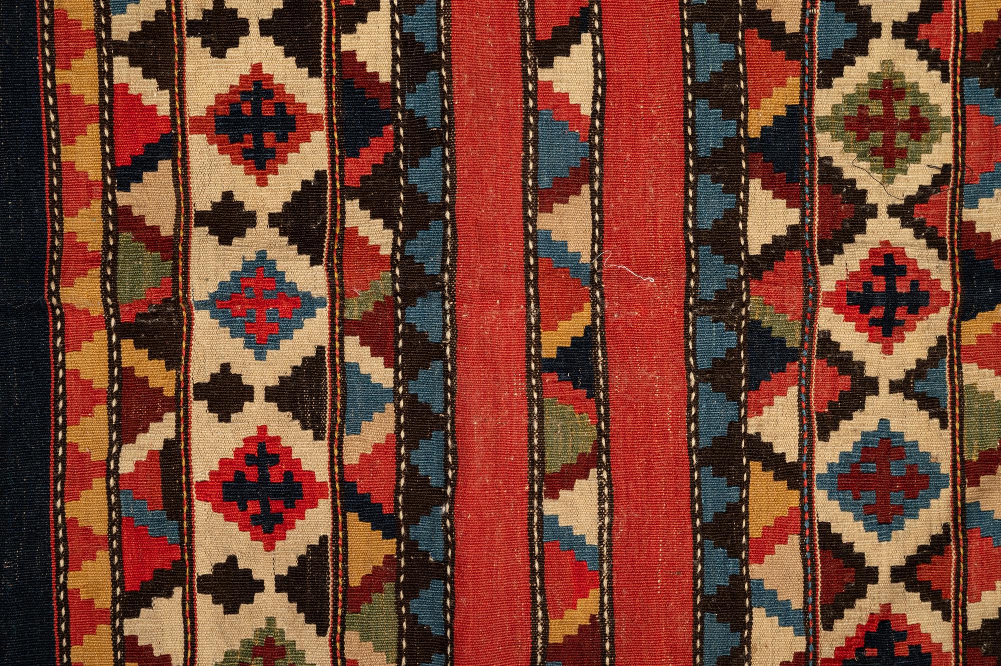 A Group of Three Kilim Rugs