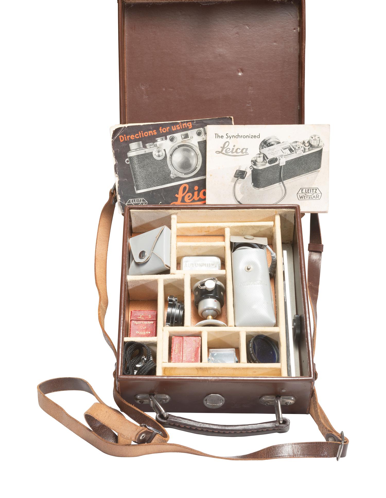 [CAMERAS]. Leica III 35mm camera with accessories and contemporary literature.