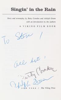 (COMDEN, BETTY AND ADOLPH GREEN) Singing in the Rain. New York, (1972). Inscribed by Comden and Green.