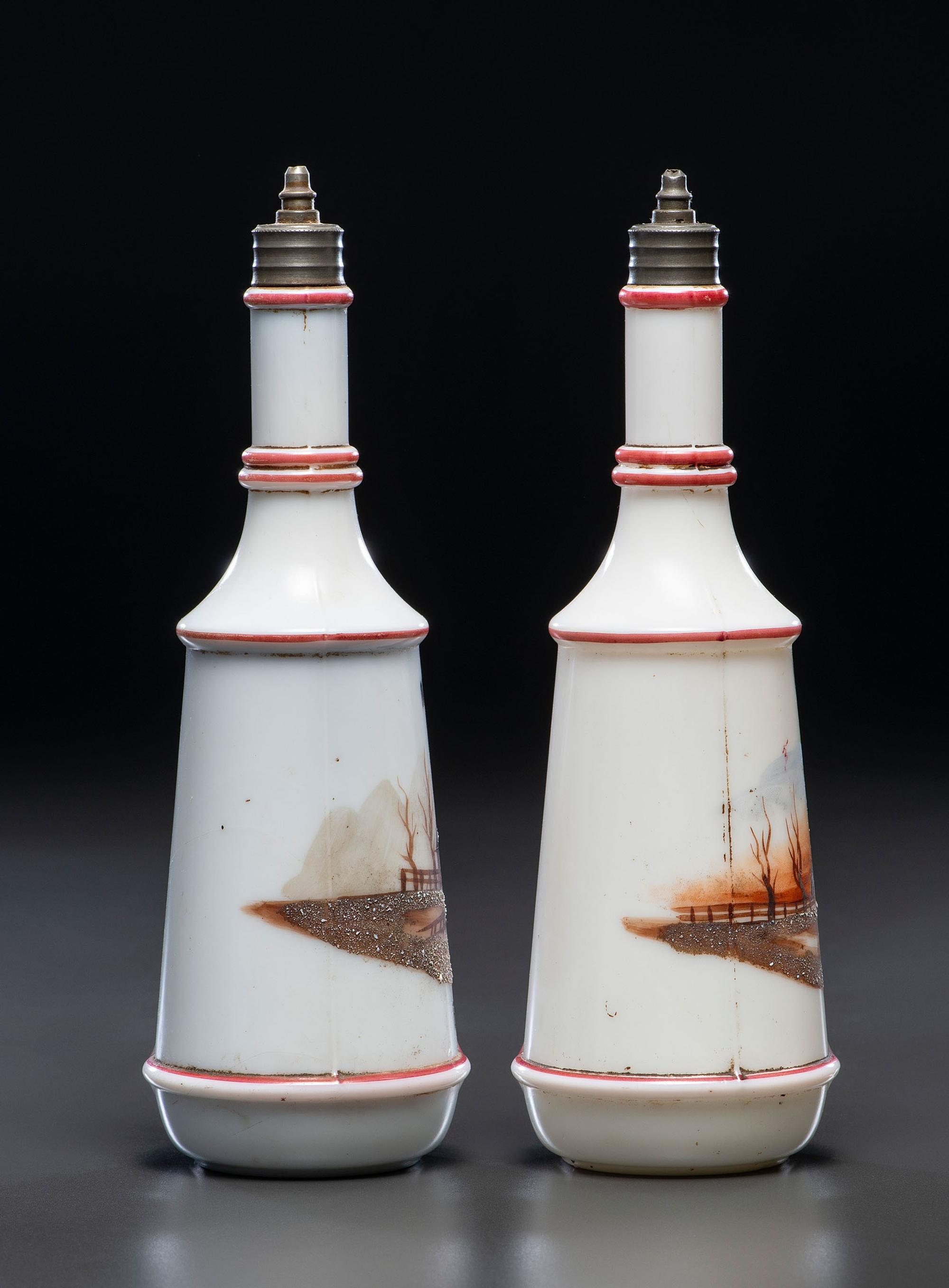 A Pair of Hand Painted Personalized Milk Glass Barber's Bottles