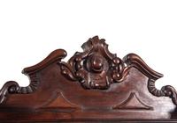 A Rococo Revival Carved Rosewood Marble-Top Serving Cabinet