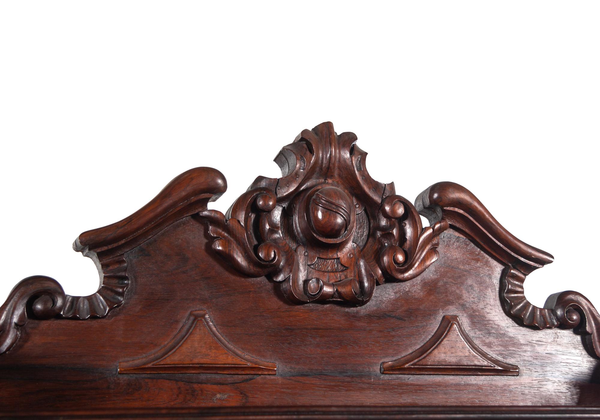 A Rococo Revival Carved Rosewood Marble-Top Serving Cabinet