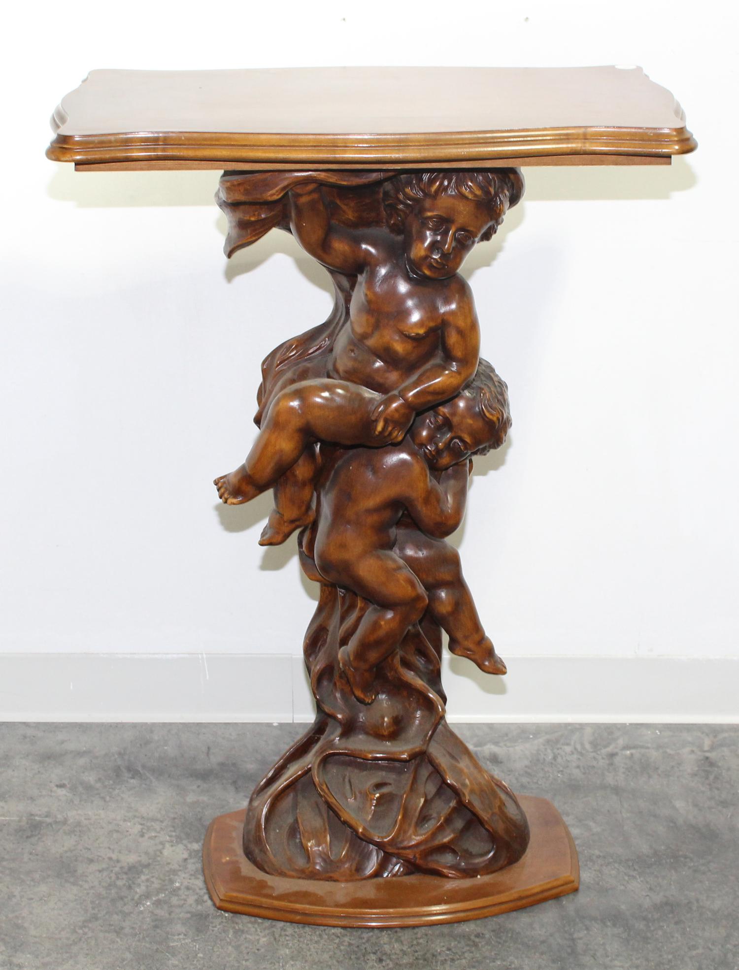 A Carved Walnut Figural Pedestal. Height 39 inches.