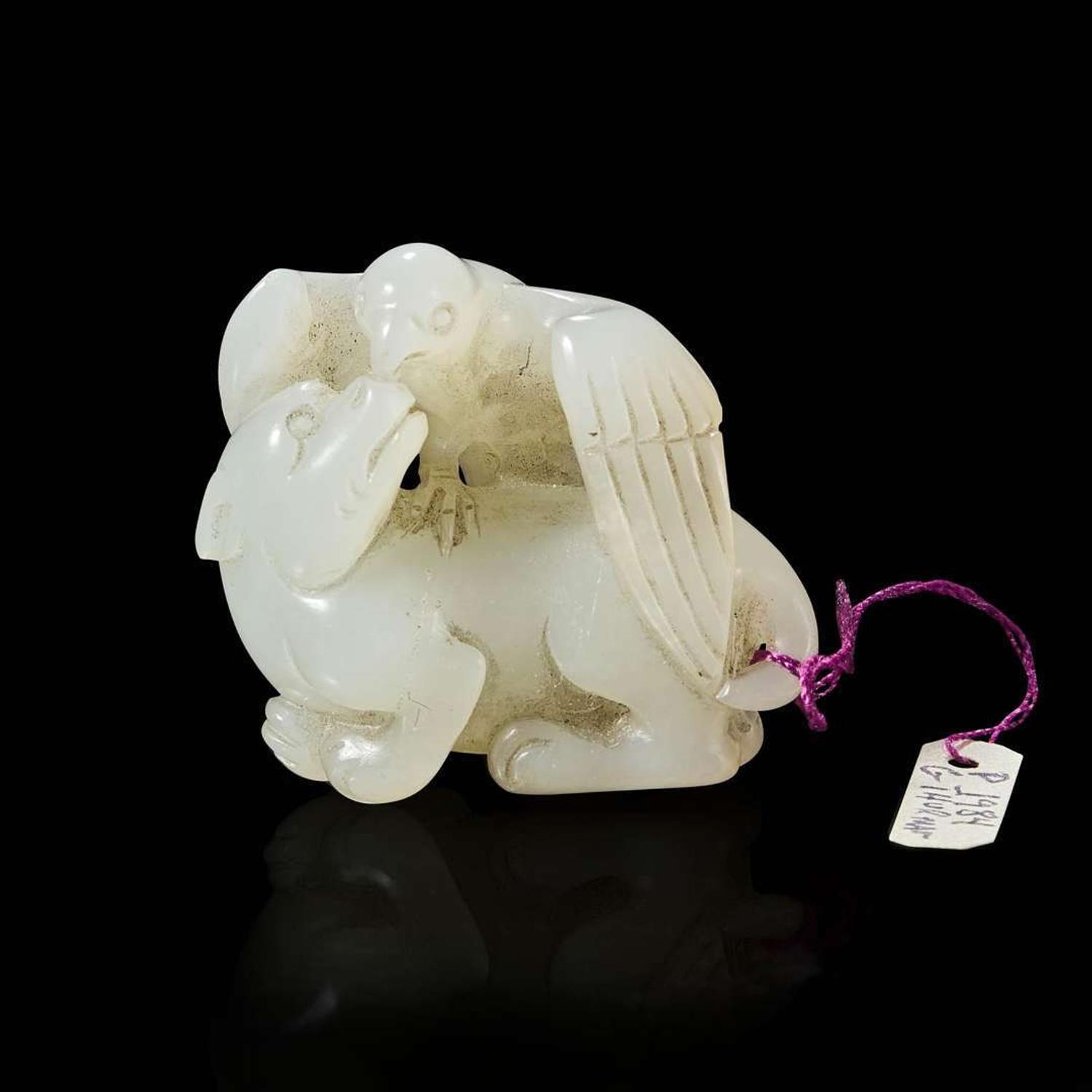 A Chinese carved white jade bird and beast pendant 玉雕一件 Qing dynasty ?
