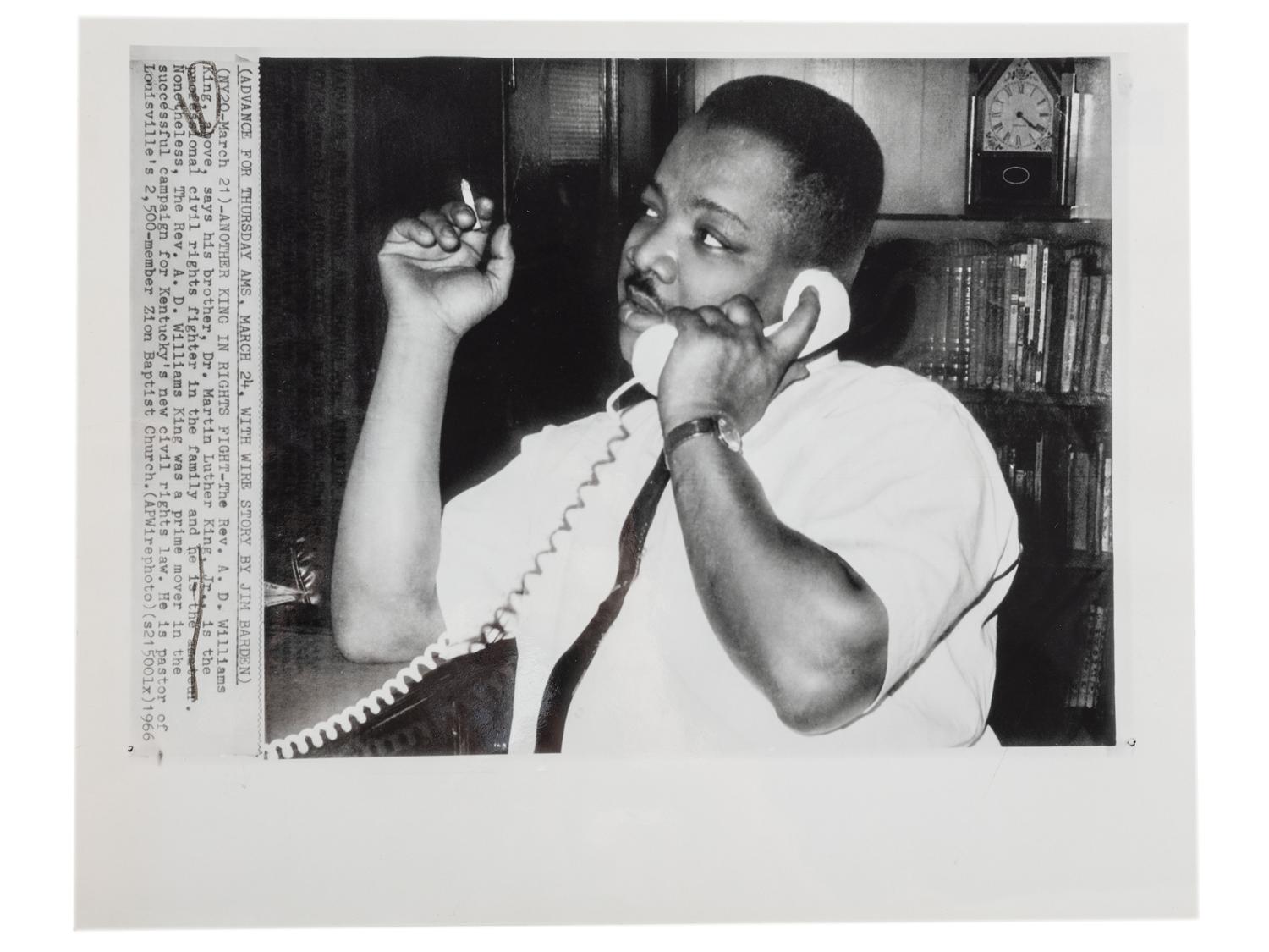 [CIVIL RIGHTS]. A group of 2 press photographs of Reverend A.D. Williams King, brother to Martin Luther King, Jr., comprising: