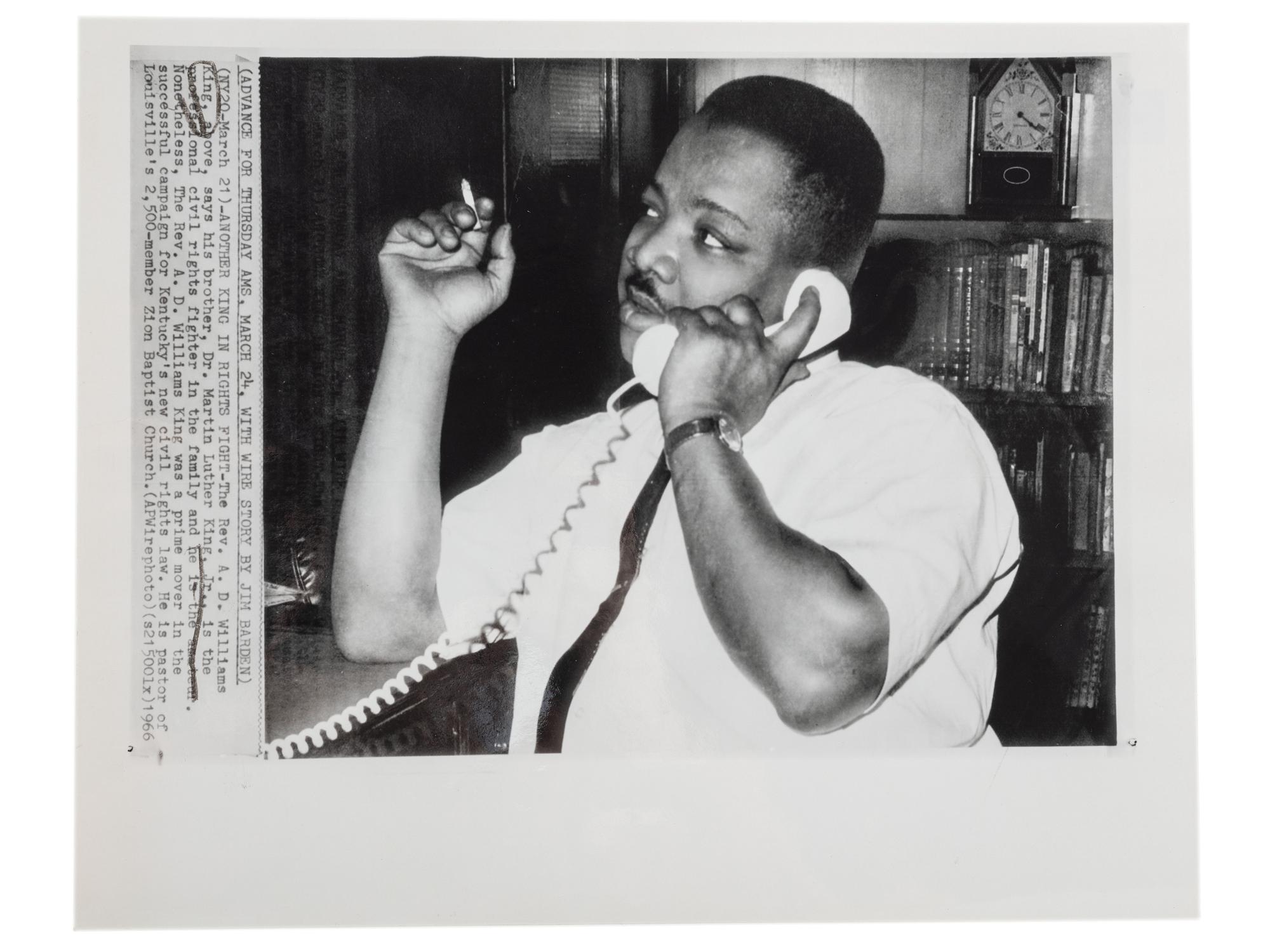 [CIVIL RIGHTS]. A group of 2 press photographs of Reverend A.D. Williams King, brother to Martin Luther King, Jr., comprising:
