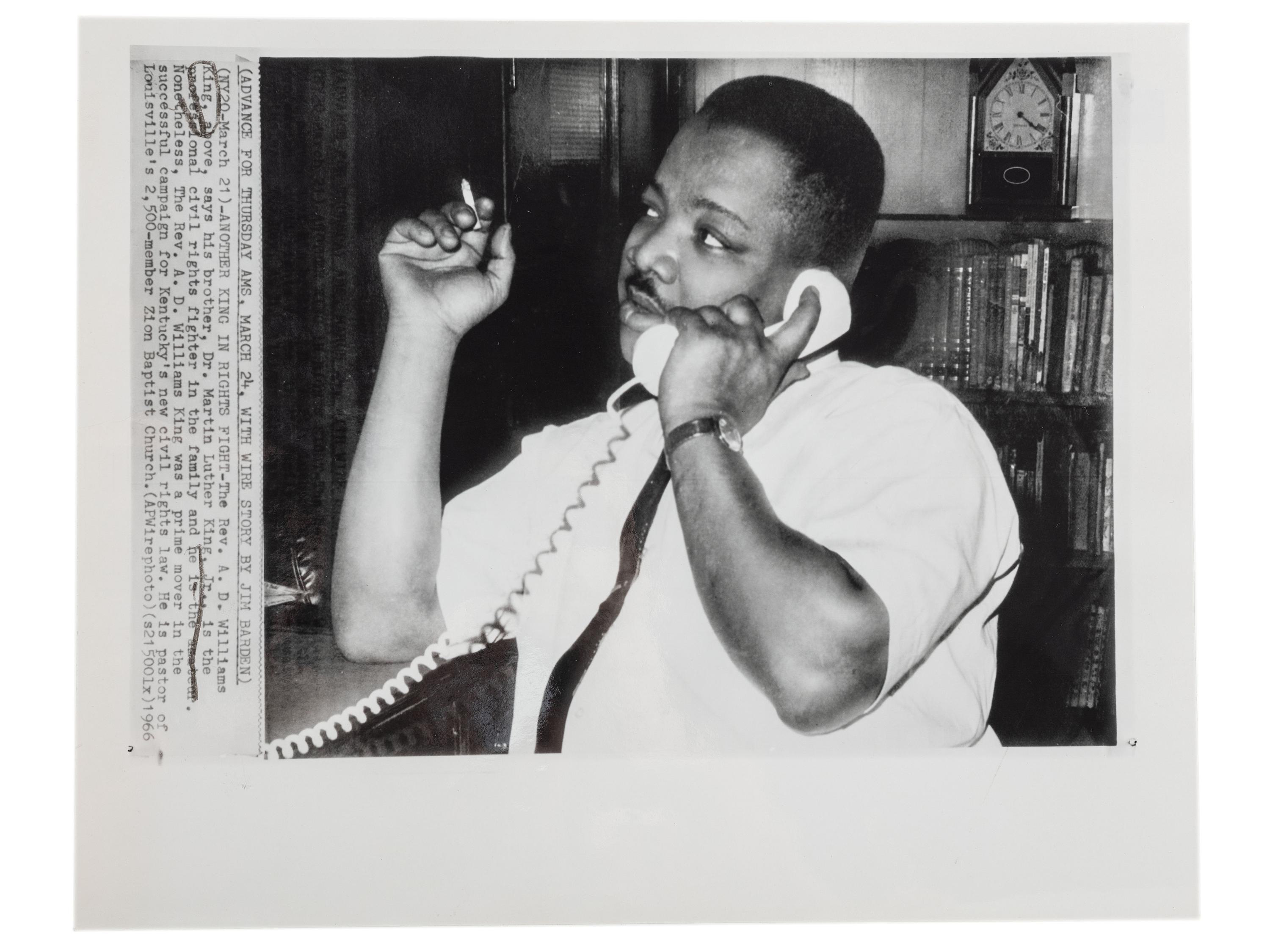 [CIVIL RIGHTS]. A group of 2 press photographs of Reverend A.D. Williams King, brother to Martin Luther King, Jr., comprising:
