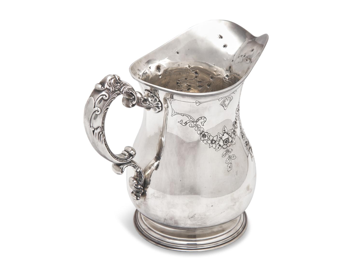 An American Sterling Silver Repousse Water Pitcher