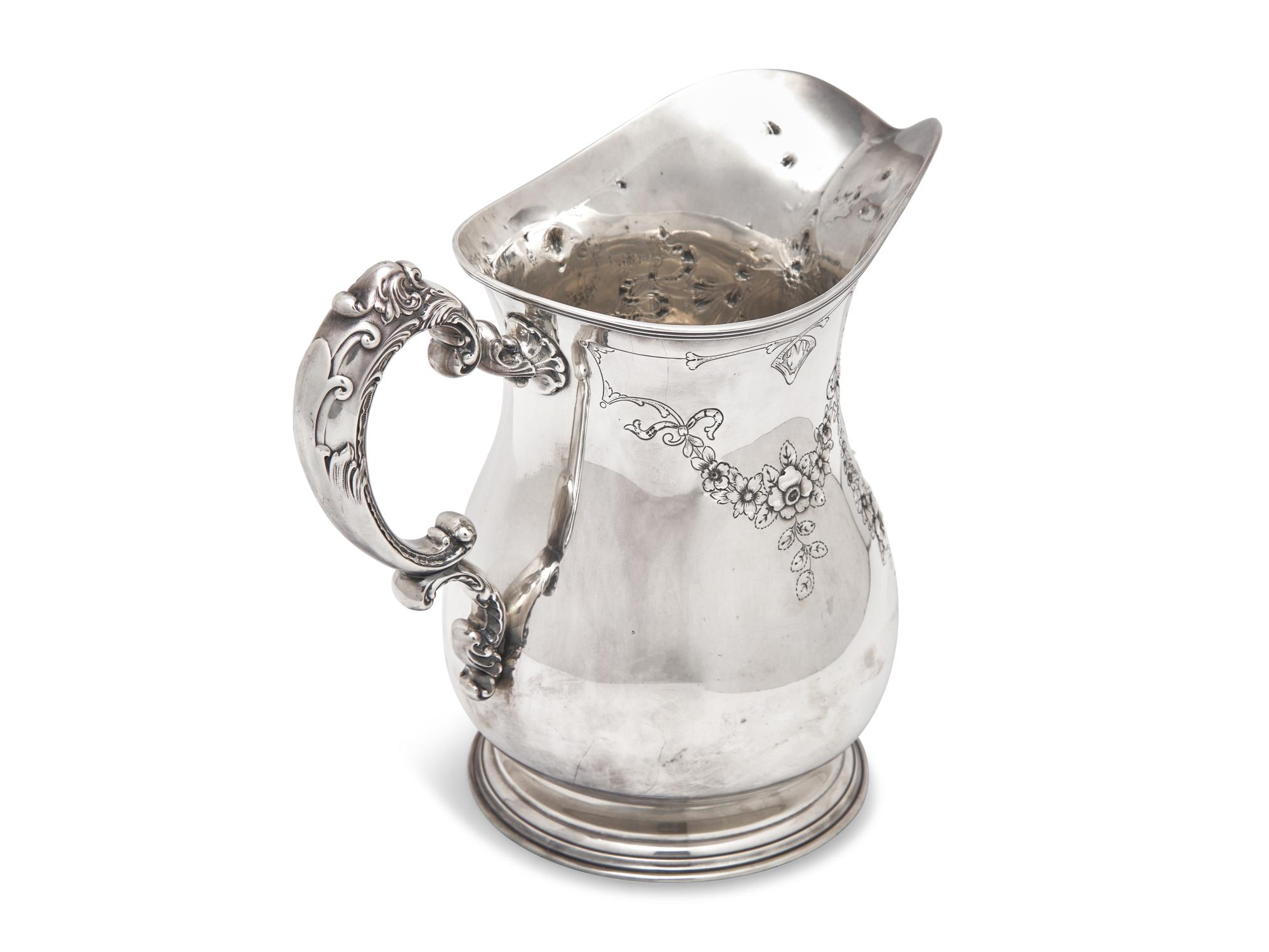 An American Sterling Silver Repousse Water Pitcher