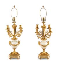 A Pair of Louis XVI Style Gilt Bronze and White Marble Six-Light Candelabra