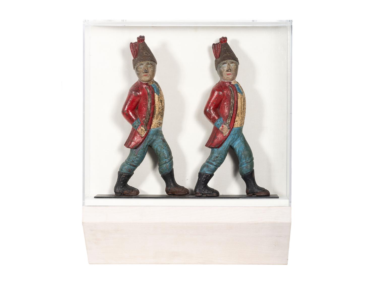 A Pair of Paint Decorated Cast-Iron Hessian Soldier Andiron Supports