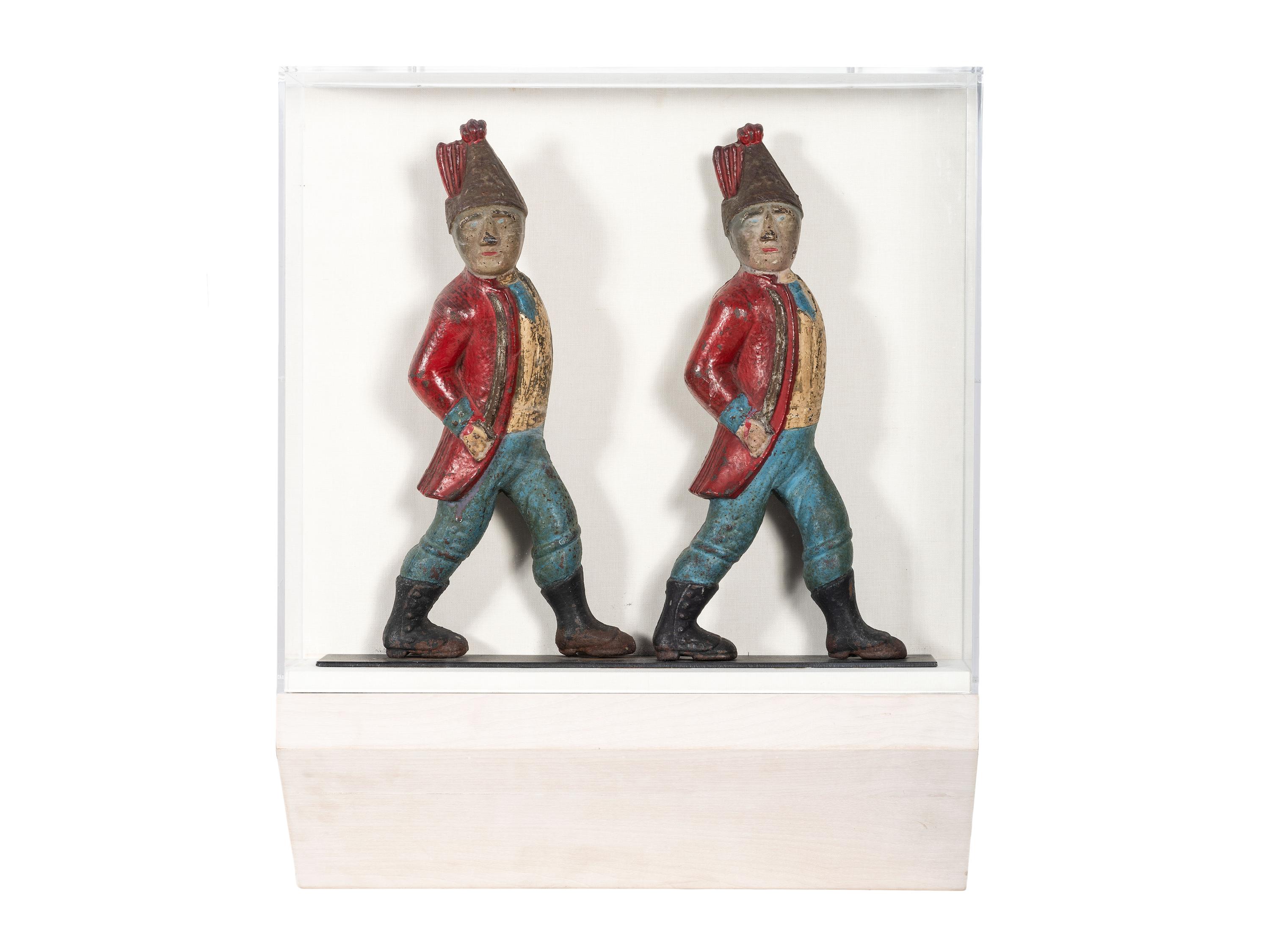 A Pair of Paint Decorated Cast-Iron Hessian Soldier Andiron Supports