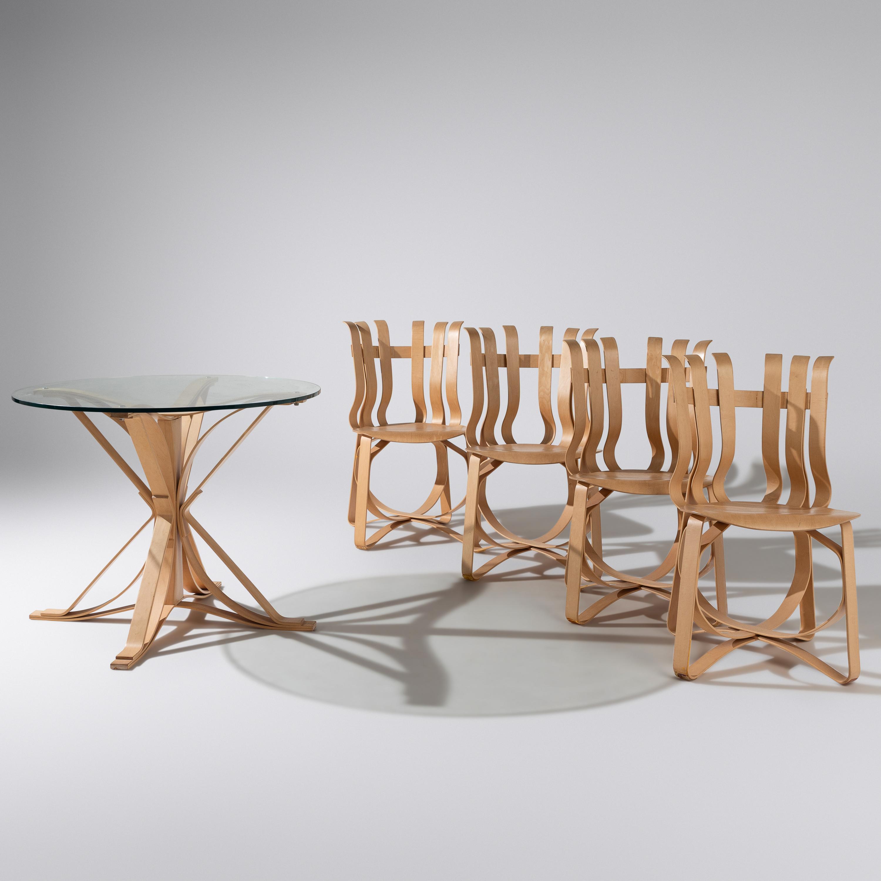 Frank Gehry (Canadian-American, 1929–2025) — Face Off table and Hat Trick Chairs, set of four KnollStudio Canada/USA, 1990 / 1993