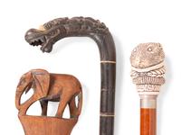 A Collection of Sixteen Carved and Mixed Metal Decorated Zoomorphic Walking Sticks