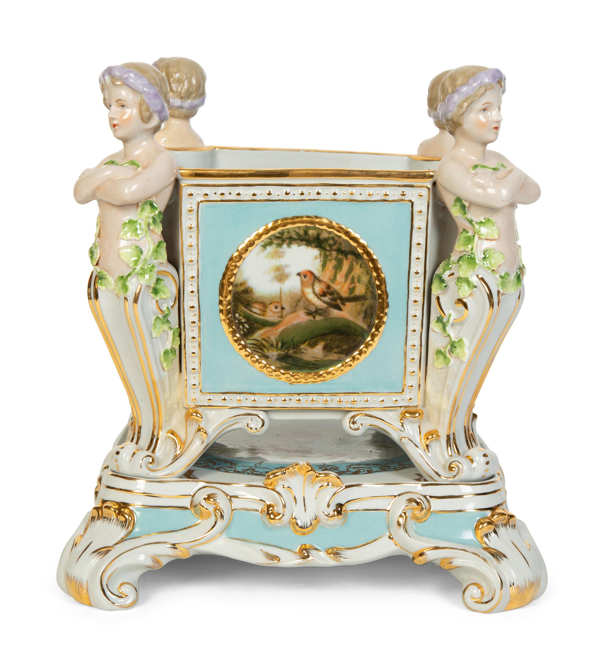 A Continental Porcelain Jardinière and Stand