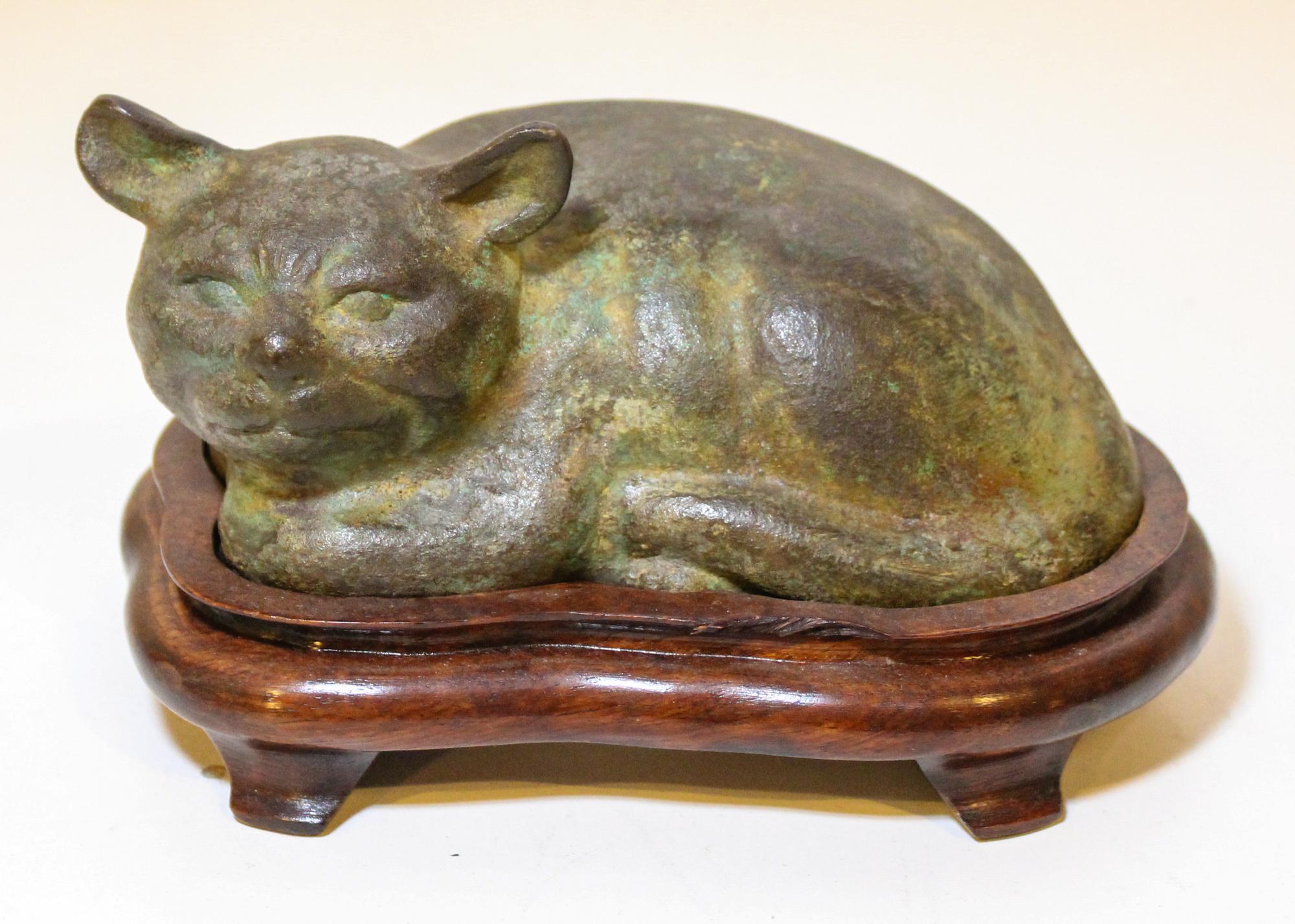 A Bronze Sleeping Cat. Width 6 inches.