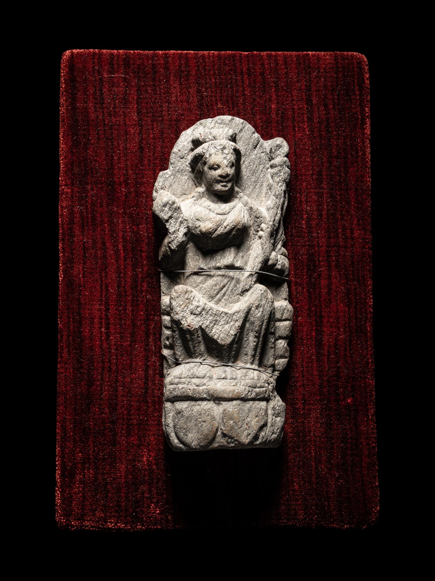 A Gandharan Schist Relief of a Musician