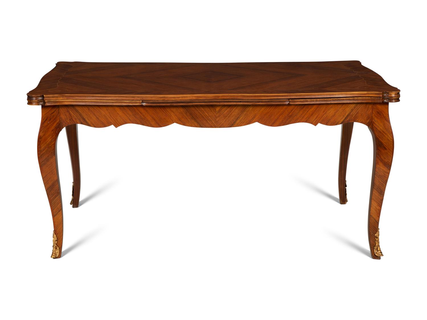 A Louis XV Style Gilt Bronze Mounted Tulipwood and Marquetry Extension Dining Table