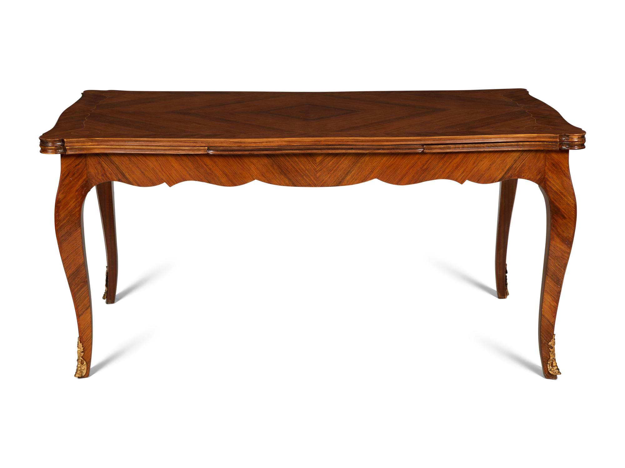 A Louis XV Style Gilt Bronze Mounted Tulipwood and Marquetry Extension Dining Table
