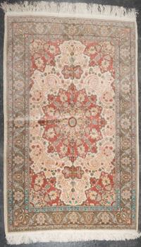 A Persian Wool and Silk Rug 5 feet 10 inches x 3 feet 10 inches. — SECOND HALF 20TH CENTURY