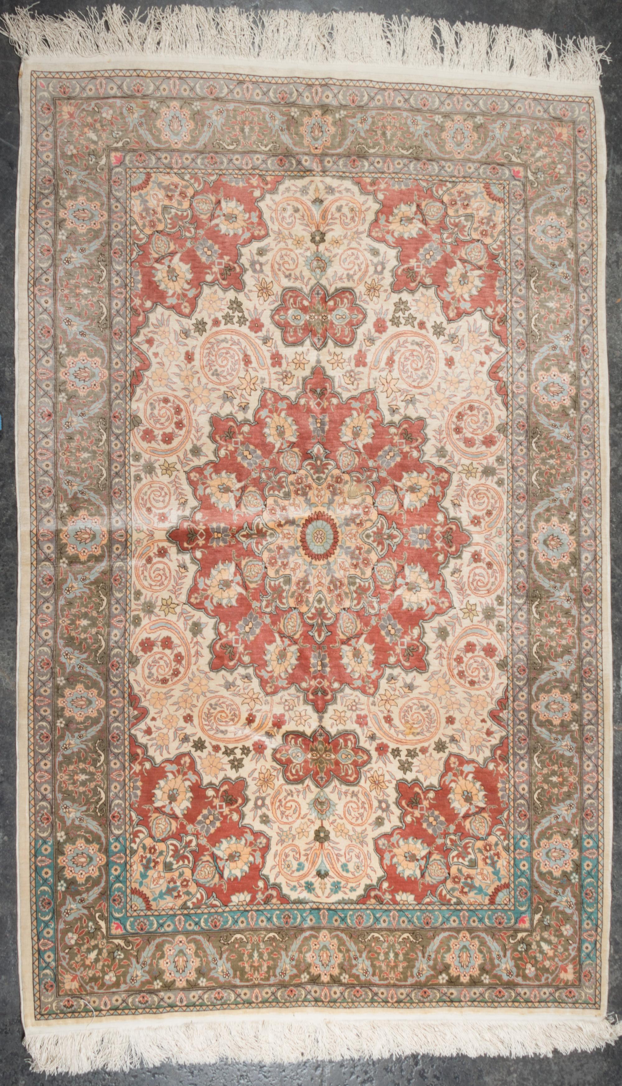 A Persian Wool and Silk Rug 5 feet 10 inches x 3 feet 10 inches. — SECOND HALF 20TH CENTURY