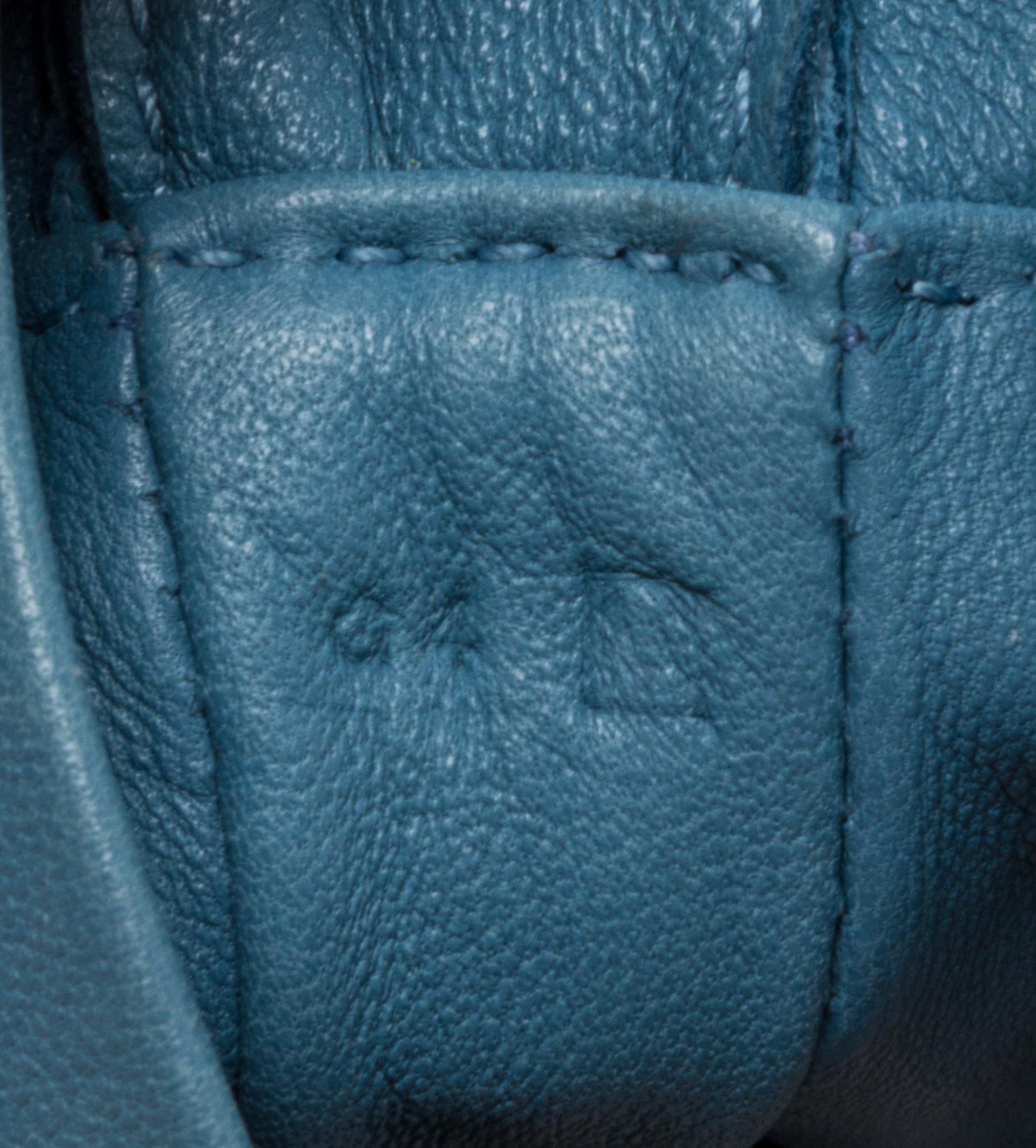 An Hermes Bleu Lin Agneau Clou de Selle Pouch, 6" x 9" x 1".
