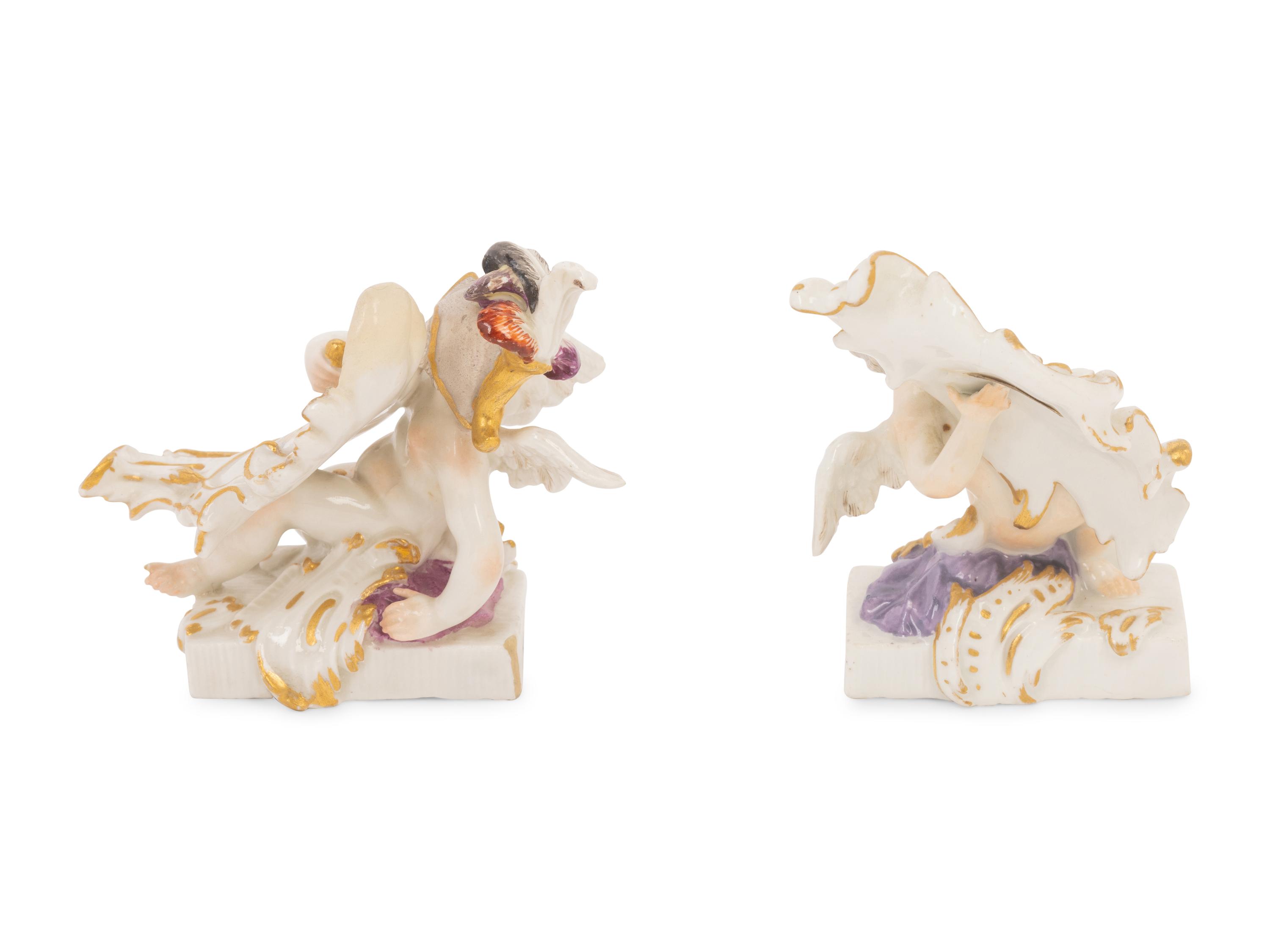 A Pair of Meissen Porcelain Figures of Putti with Cartouches