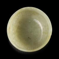 A Chinese Celadon Jade "Rice Measure" Cup, Late Ming-Early Qing — 明末清初 笸籮紋玉碗